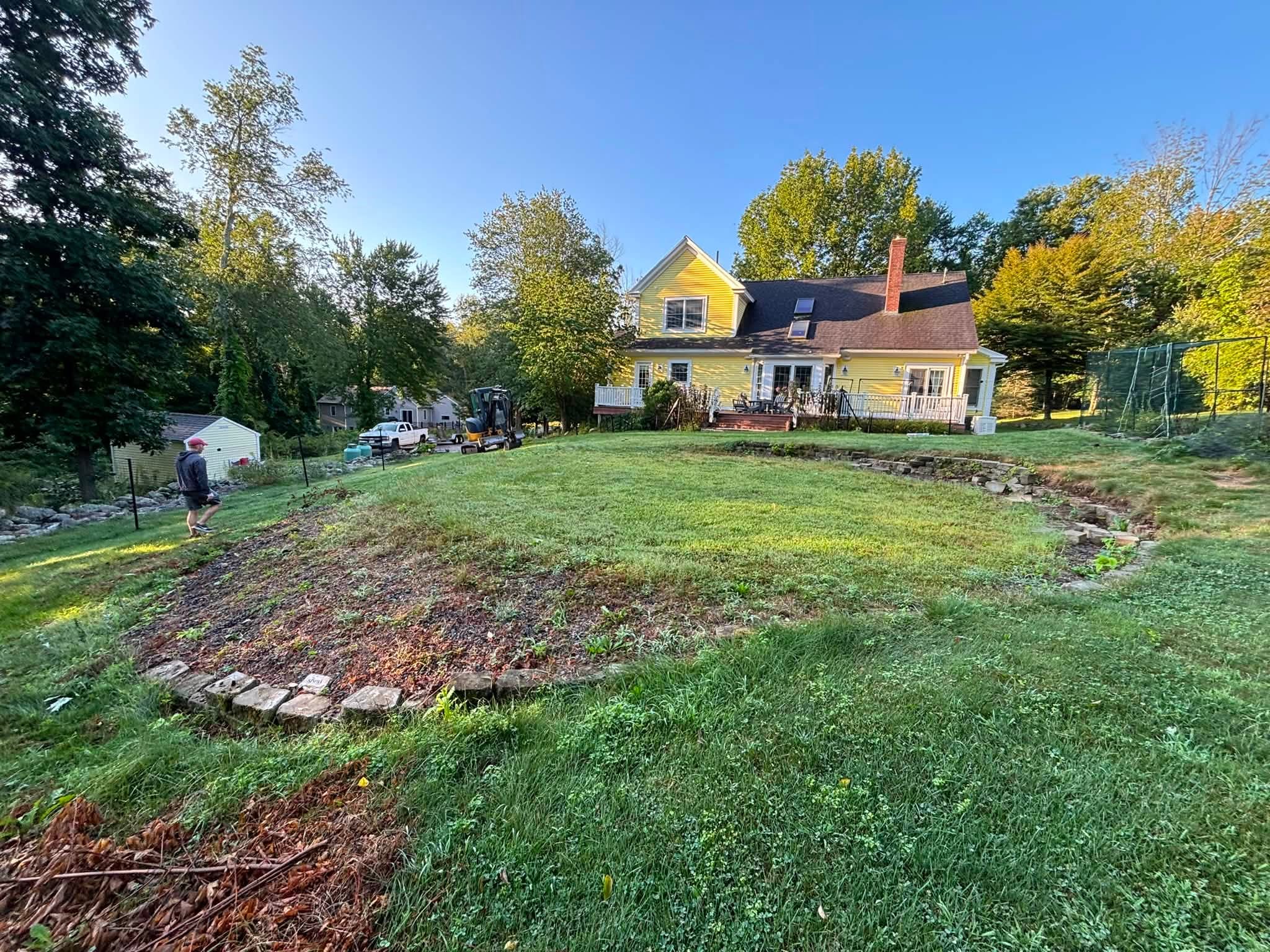 Backyard before pool removal — flat base taking up yard space